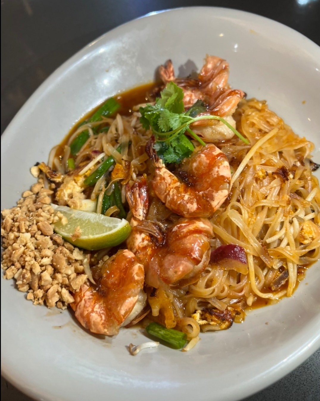 Drunken noodles with chicken, chilli and basil.