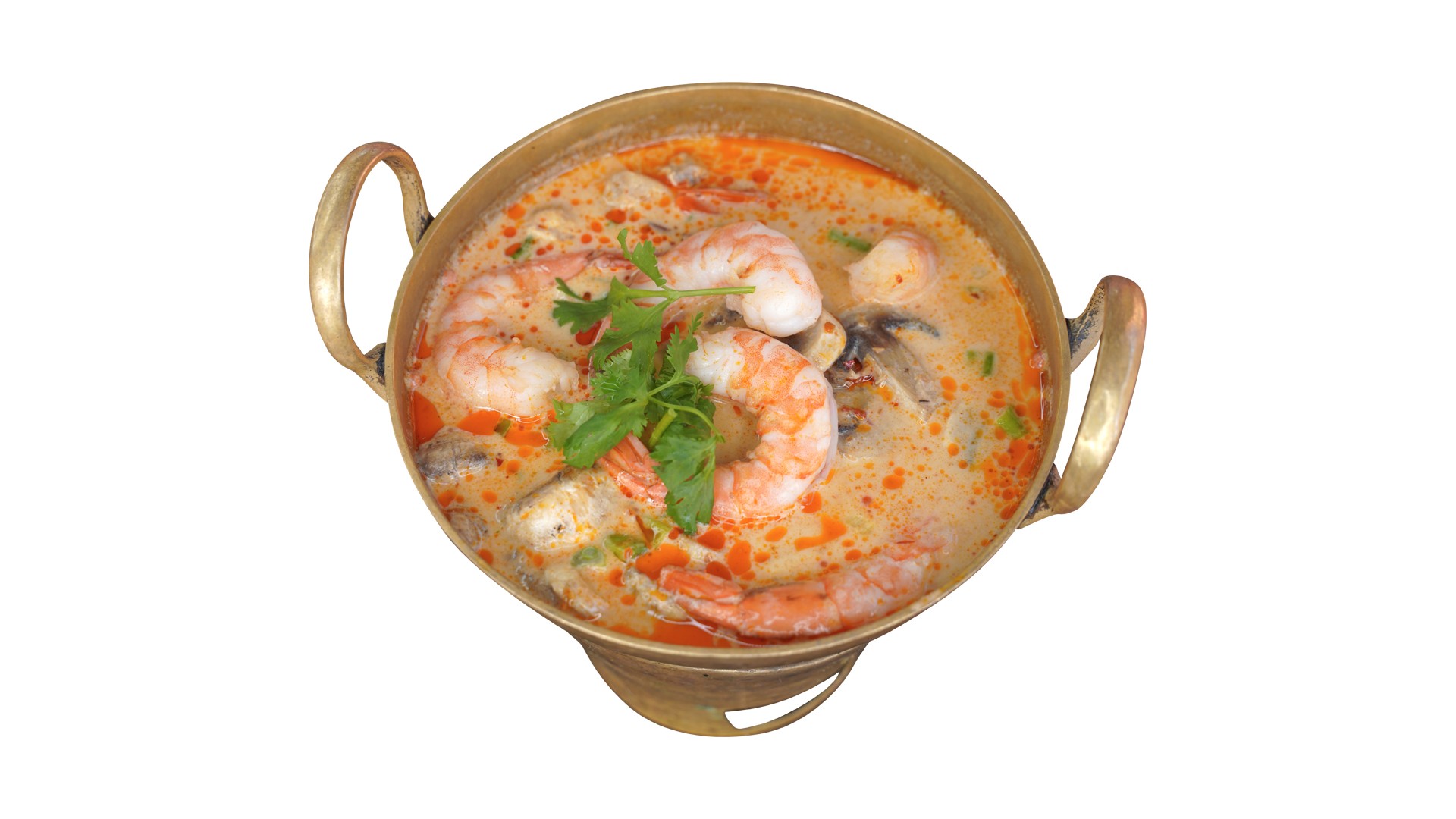 A seafood curry served in a brass pot.